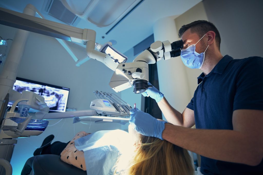 Dentist performing a dental exam in Leawood, KS